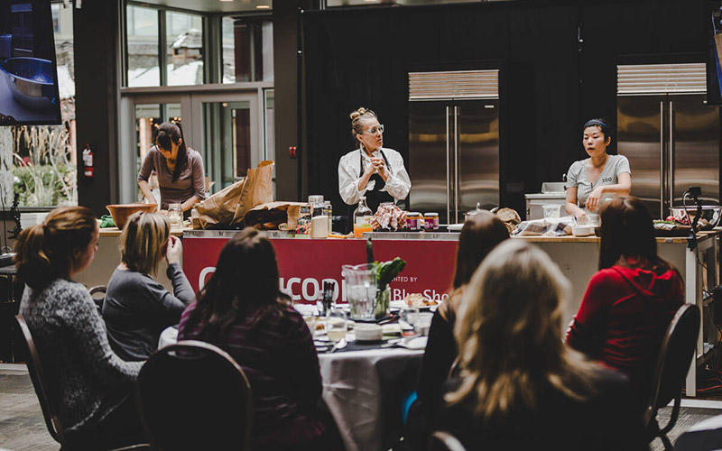 A chef presenting during Culinary Stage Series at Cornucopia Whistler