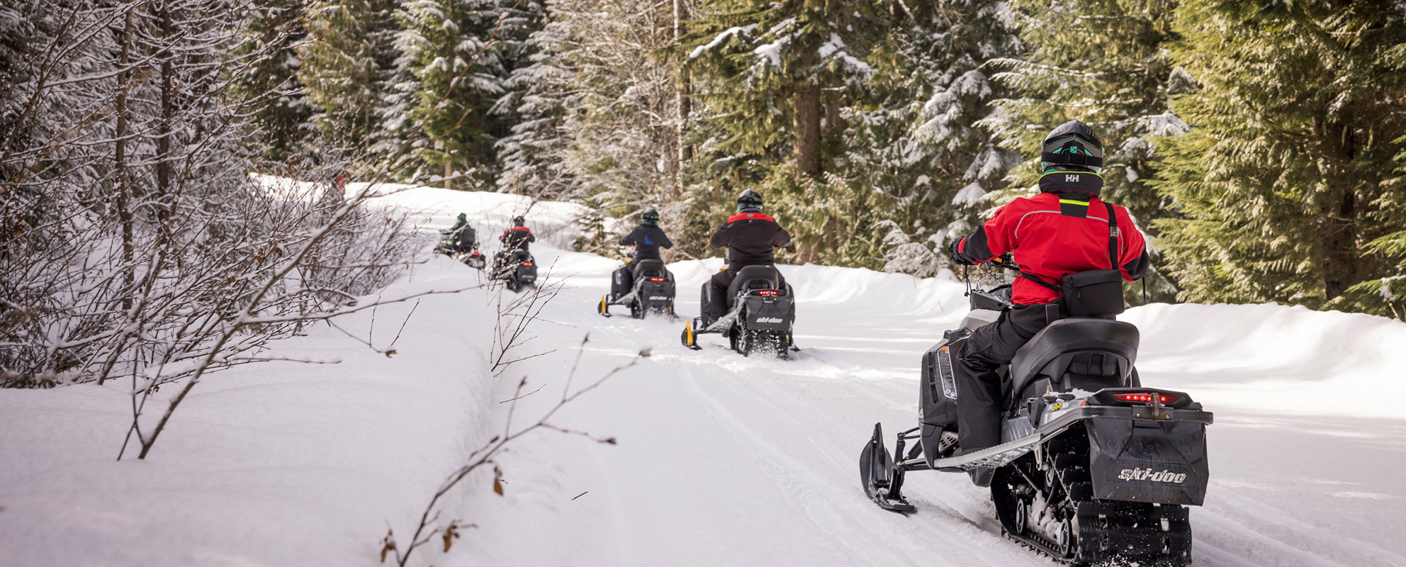 Meetings group snowmobiling in the Whistler backcountry